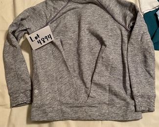 Lot 4894. $125.00  Six Activeware Garments - Lululemon Haul: Velour Wideleg Drawstring Pants (sz 2), oh so soft cotton joggers (size 4), 2 ribbed tanks with bralets, 1 ribbed tank no liner, and a gray rear gathered sweatshirt. (all shirts seem to be small or xsmall). All are in like new condition.  Consignor is/was a "Lululemon Ambassador," where the company would give her complimentary clothing for her promotion of their local store to her clients in her personal training and yoga studio.  Hence she removed tags before consigning garments. 