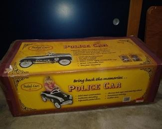 New in box police pedal car - never opened