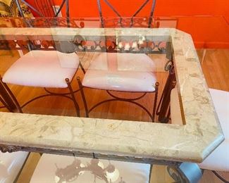 Glass Top Fortunoff Dining Table accented by Marble around it