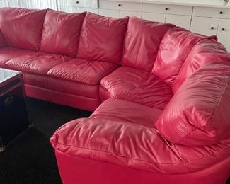 $525                Red 5 sectional lether sofa  104" maximum 
length x 33" h