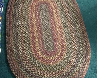 Braided oval rug ~5' long