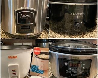 A large selection of crock pots, pressure cookers, and other kitchen appliances.