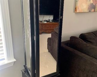 Rotating mirrored jewelry cabinet