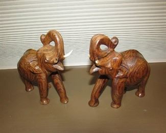 •	Item 16: Set of (2) carved wooden elephants. (Tusks are as-is on both). Each approximately 6”wide x 6”tall x 3”deep. PRICE FOR TWO: $20.00