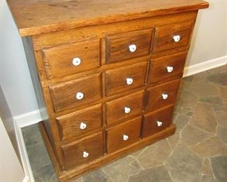 •	Item 26: Small oak 12-drawer apothecary-style chest. 27”wide x 15”deep x 28.5”tall. PRICE: $150.00