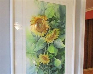 •	Item 27: Sandy Beamer watercolor of sunflowers. (Framed at Creative Framing). Framed dimensions are 21.5”wide x 31.5” tall. PRICE: $75.00