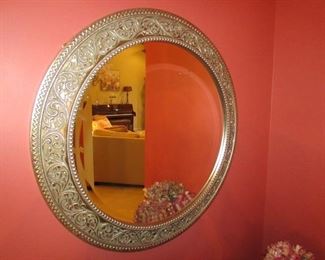 •	Item 32: Bombay Company ornate silvered beveled mirror. 26” diameter. PRICE: $40.00