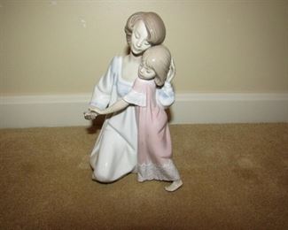 •	Item 41: Lladro 5449 Mother and Daughter “Good night” figure. No visible cracks or chips upon inspection. No box. Approximately 6”wide x 8”tall. PRICE: $75.00.