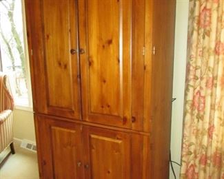 •	Item 49: Rustic pine armoire / entertainment cabinet. Chip to bottom left corner. 40”wide x 24”deep x 74” tall. PRICE: $125.00