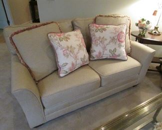 •	Item 60: Miles Talbott tan/neutral color loveseat with (4) pillows. 63”wide x 37.5”deep x 33”tall. PRICE: $250.00