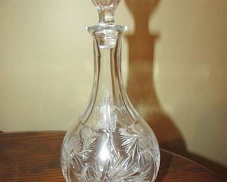 •	Item 63: Heavy cut crystal decanter. No makers markings found. Approximately 10” tall x 4” wide. PRICE: $20.00