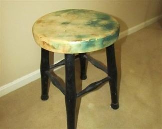•	Item 77: Small distressed painted green and black stool. 12” diameter x 18” tall. PRICE: $40.00