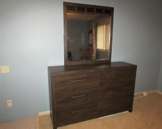 •	Item 88: Compressed wood dresser with (6) drawers and mirror. 58” wide x 16” deep x 75” tall. PRICE: $150.00