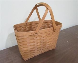 •	Item 107: Longaberger basket: 16” wide x 8.75” deep x 18” tall (to top of handle). PRICE: $30.00