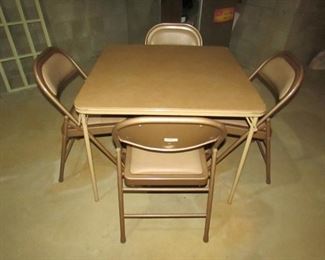 •	Item 115: Card table with (4) folding chairs. 2.5” slice to top and slight rusting to chairs. Table is 33.5” square. PRICE FOR SET: $20.00
