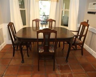 antique dining table with 3 extra leaves and 6 chairs