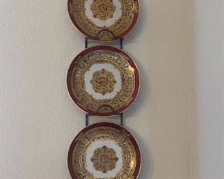 $80 3 CHINA PLATES IN RACK RED AND GOLD