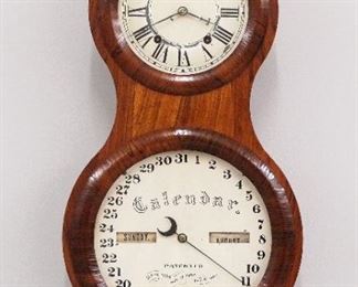 A late 19th century Seth Thomas Office Calendar No. 3 "Peanut" wall clock. 8-day time and strike movement with painted metal dials, Roman numerals on time dial and Arabic numerals on calendar, original "S T" hands. Rosewood case with shaped door and two circular glasses, original paper label on back of door. Old finish with slight wear, minor veneer ripples, paint loss to upper dial, running when cataloged. 24" high overall. ESTIMATE $2,000-3,000