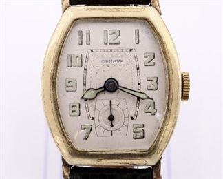 A vintage Vitalis Swiss wristwatch. 15 jewel manual wind movement with Silvered dial, luminous hands and Arabic numerals marked "Geneve", in a hinged 14k Gold plated case with replaced leather strap. Some wear, monogrammed back cover, running when cataloged. ERSTIMATE $200-300