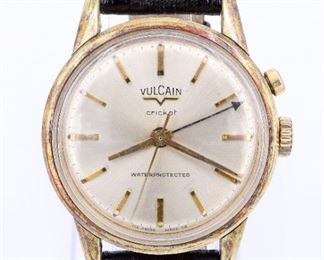 A vintage Vulcain "Cricket" wristwatch. Manual winding movement with "Cricket" alarm, round Gold dial with baton markers, in a 34 mm gold filled case with replaced leather strap. Reference #S23125A. Case unopened, some wear, running when cataloged. ESTIMATE $600-800