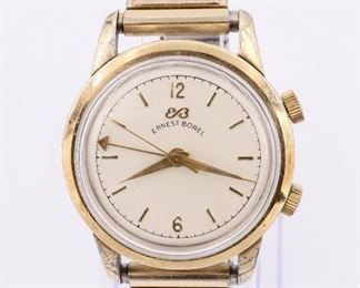 A vintage Ernest Borel "Cricket" wristwatch. Manual winding movement with "Cricket" alarm, round Silvered dial with baton markers, in a 34 mm gold filled case with replaced Speidel band. Case unopened, some wear, running when cataloged. ESTIMATE $200-300