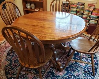 Wonderful Round Pedestal Table with Four Chairs and 1 very large Leaf