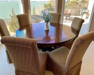 5’ round table with 6 Parson-style chairs, priced separately