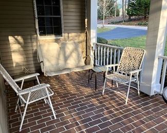 Folding chairs, porch swing and small glass top table