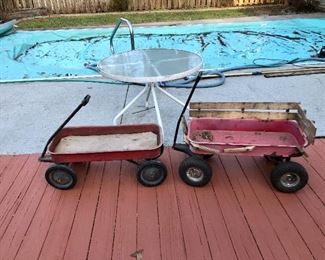 Two red wagons and round glass top table!