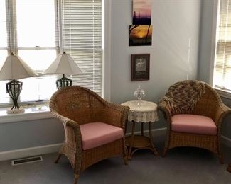 wicker chairs, round table, two large lamps