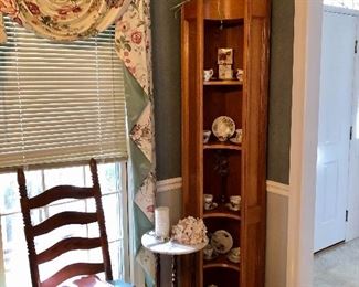 Corner cabinet full of tea cups
