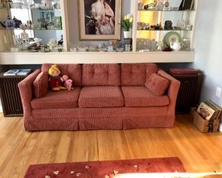One of two sofas, Kenwood large speakers, old county albums, glass shelves full of smalls, Dapper Dan Doll