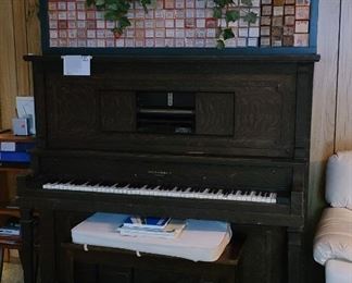 Up right player piano with 175 music scrolls