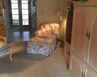 Chair and ottoman, entertainment center, floor lamp, pictures