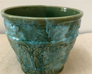 Ceramic pot measures 7 1/2" tall with a 7" opening