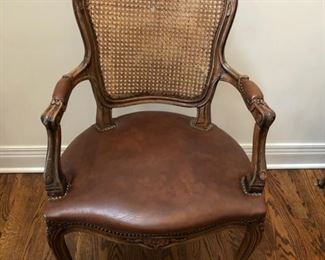 Antique cane and leather armchair