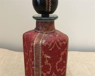 Tapestry and leather clad decanter