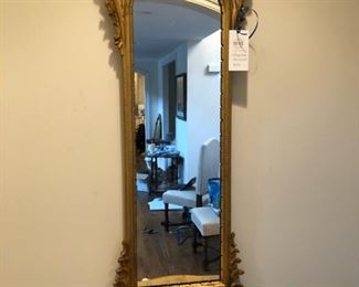Gold LaBarge entry mirror with shelf. Measures 58" W x 18" W x 7" D