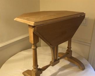 Drop leap-side table. 24" H x 25"W. Measures 7" W when both sides are down