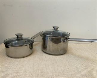 From left to right: Wolfgang Puck Bistro Collection 2 quart sauce pan with lid (like new); Wolfgang Puck Bistro Collection 4 quart sauce pan with lid (like new)