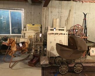 Cross country skis, vintage bouncy horse, cribs, pram, rugs, doll cribs, high chair