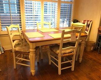 Legacy Classic kitchen table with six chairs. Four chairs shown. Extension extends seating to 6