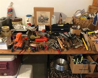 Assorted tools including wrench set, power drill
miter saw, Black & Decker Jig Saw, paint brushes and rollers, plumbing wrench, hammer, mallet, belt sander,
drill, hack saw, hedge trimmer, spade, ax, pitch fork, sprinklers