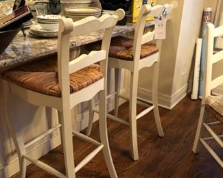 Two Legacy Classic cane-seat bar stools