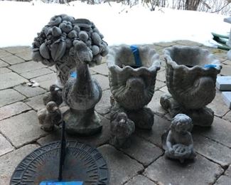 Stone and resin garden planters and statues. Copper sun dial