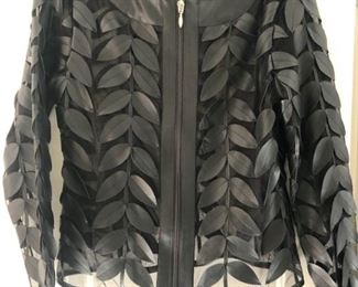 Colleen Lopez cutout faux leather jacket. Runs large. One of our favorites from more than 100 pieces of designer clothing and coats in sizes S, M & L and Size 2 - 10