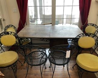 Antique Woodard Chantilly Rose extension wrought iron dining with wood top and 6 chairs. Two are missing cushions