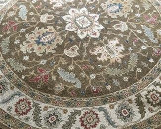 8-foot round Toms-Price wool floral rug