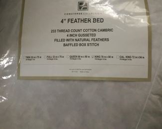 King size 4" feather bed. New in original packaging!