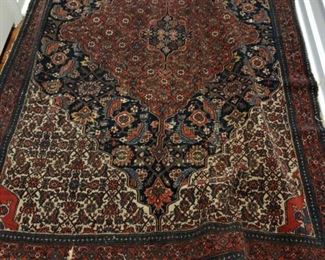 Antique Persian rug measures 4' 2" x 6' 8." Photo 1 of 2